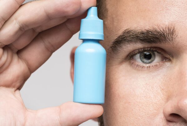man-holding-medicinal-bottle